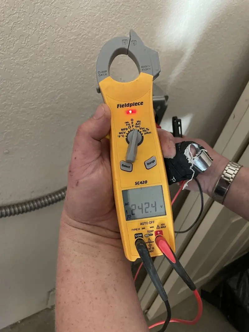 Voltage testing with clamp meter during Electrical Installation Services in North Haledon
